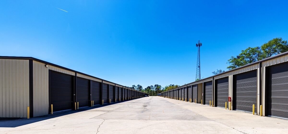 Wide drive aisle lined with storage units at the Go Store It facility in Davenport, FL